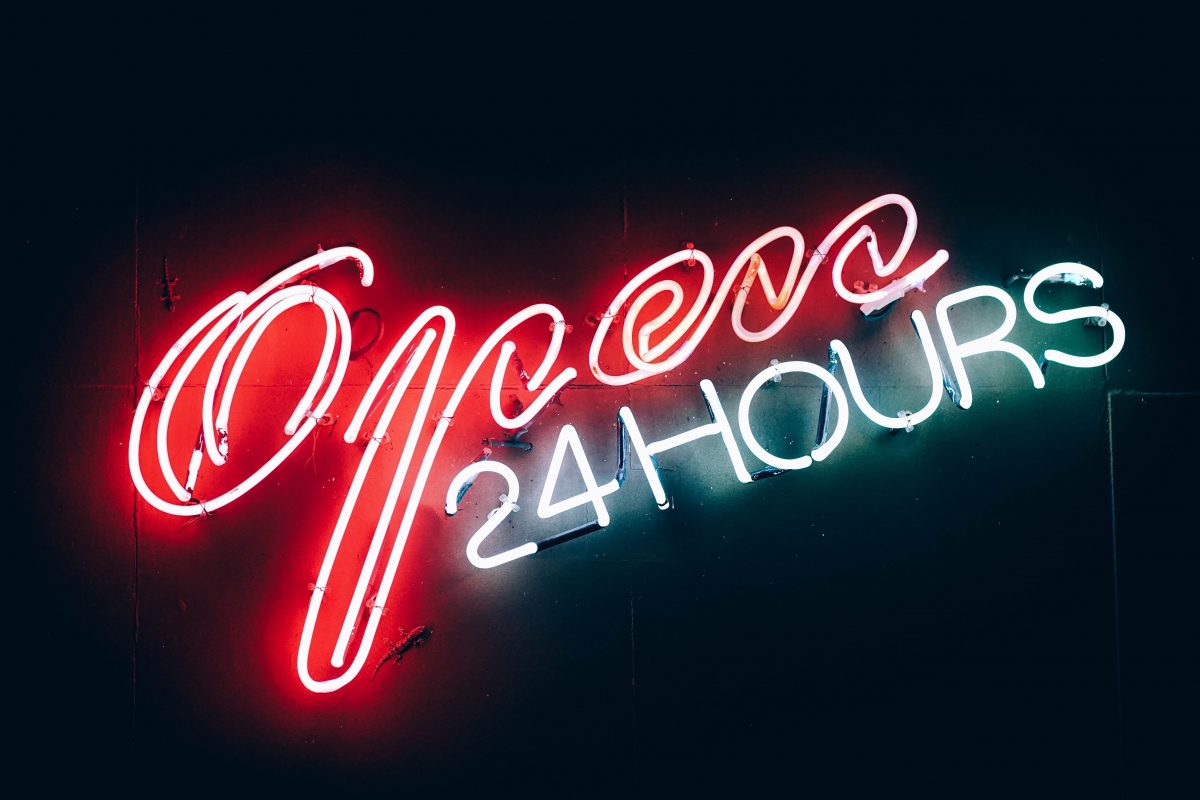 neon sign that says "Open 24 hours"