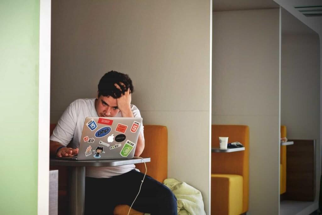 frustrated man working on a computer