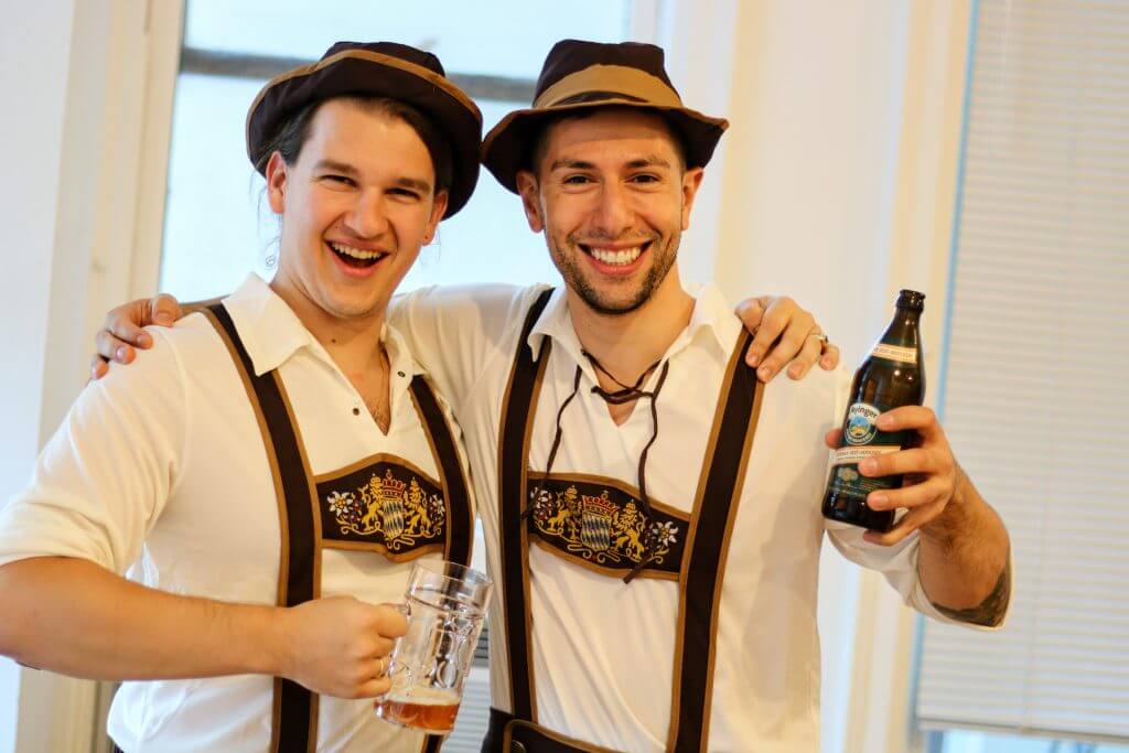 Daniel and Kyle in lederhosen with beer