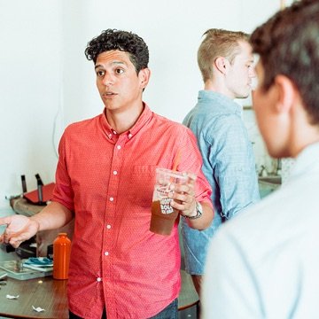 Clique team member engaged in conversation at a networking event