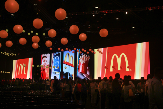 Hundreds of attendees in a conference room at McDonald's Worldwide