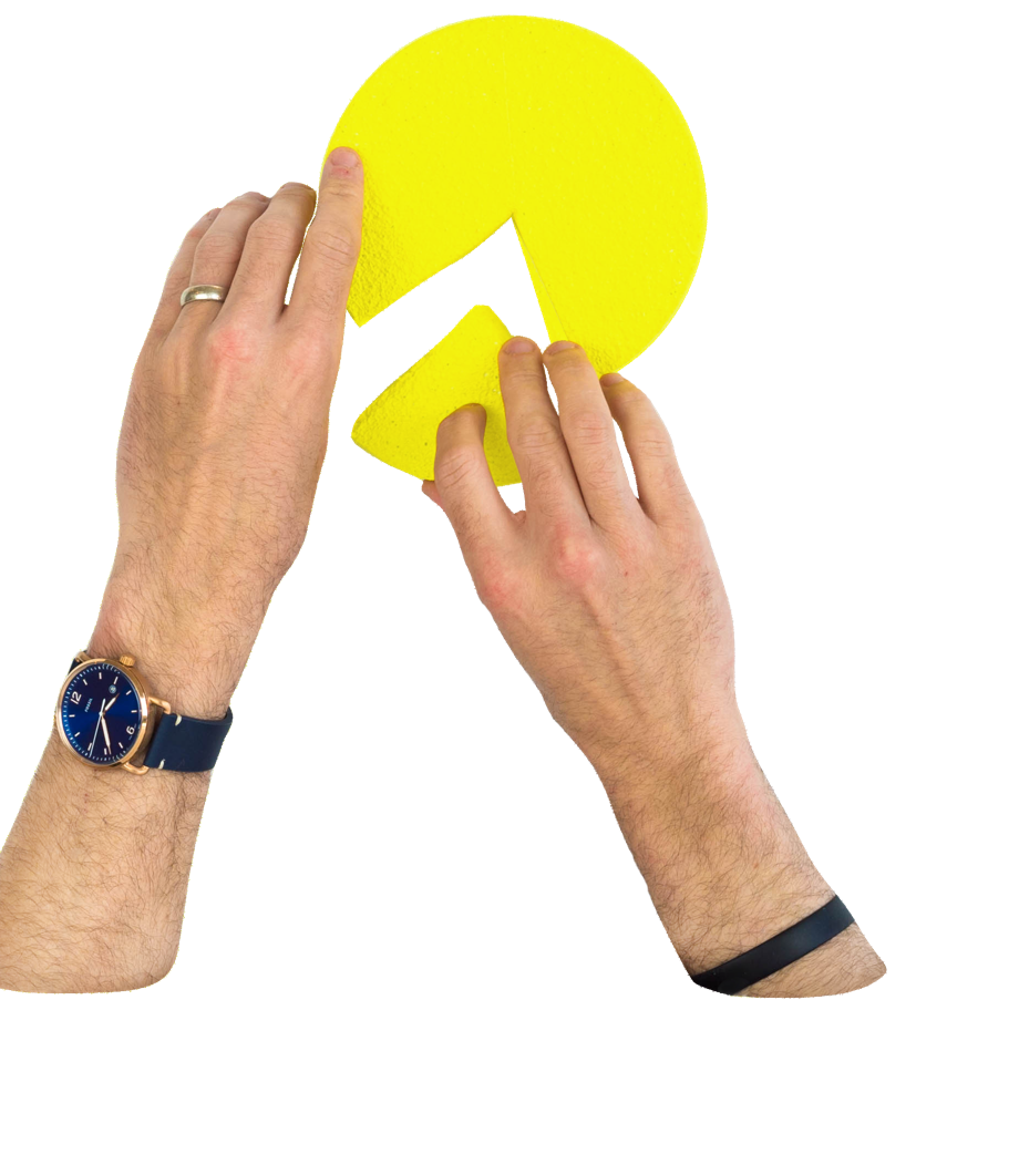 Hands putting together a pie chart with a missing piece