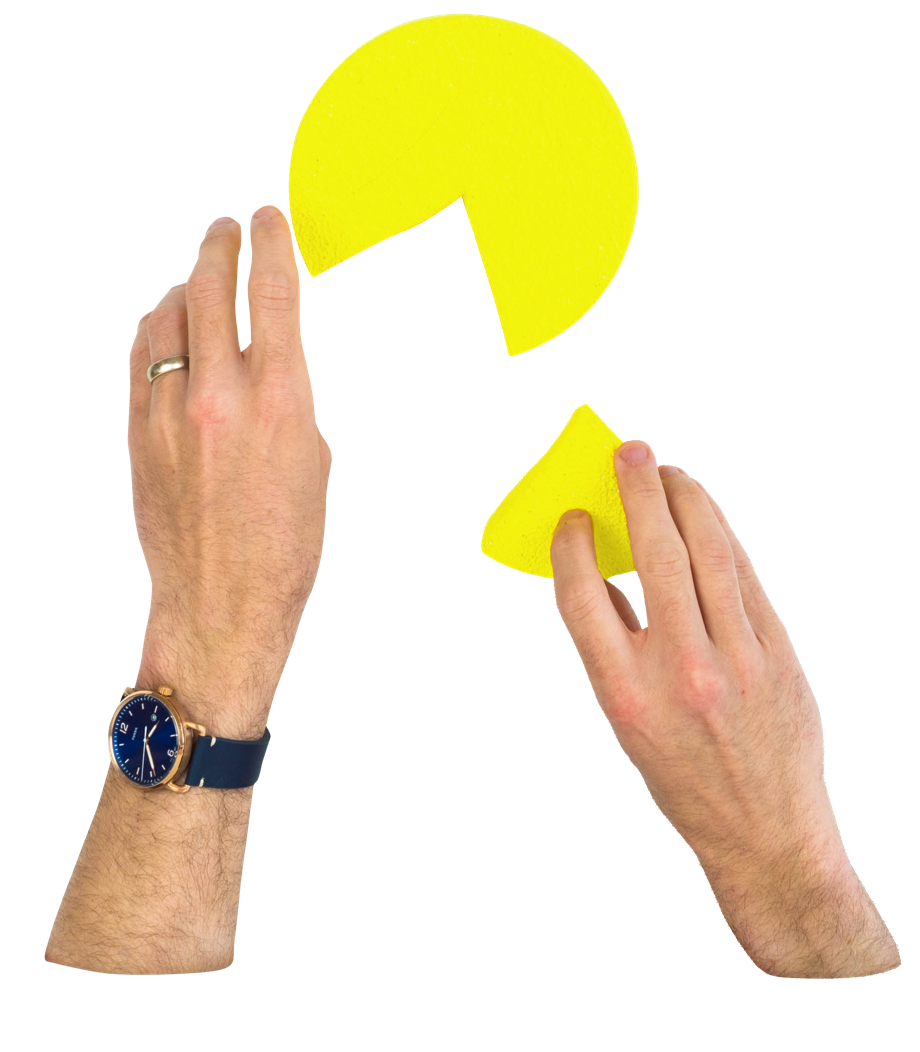 Hands putting together a pie chart with a missing piece