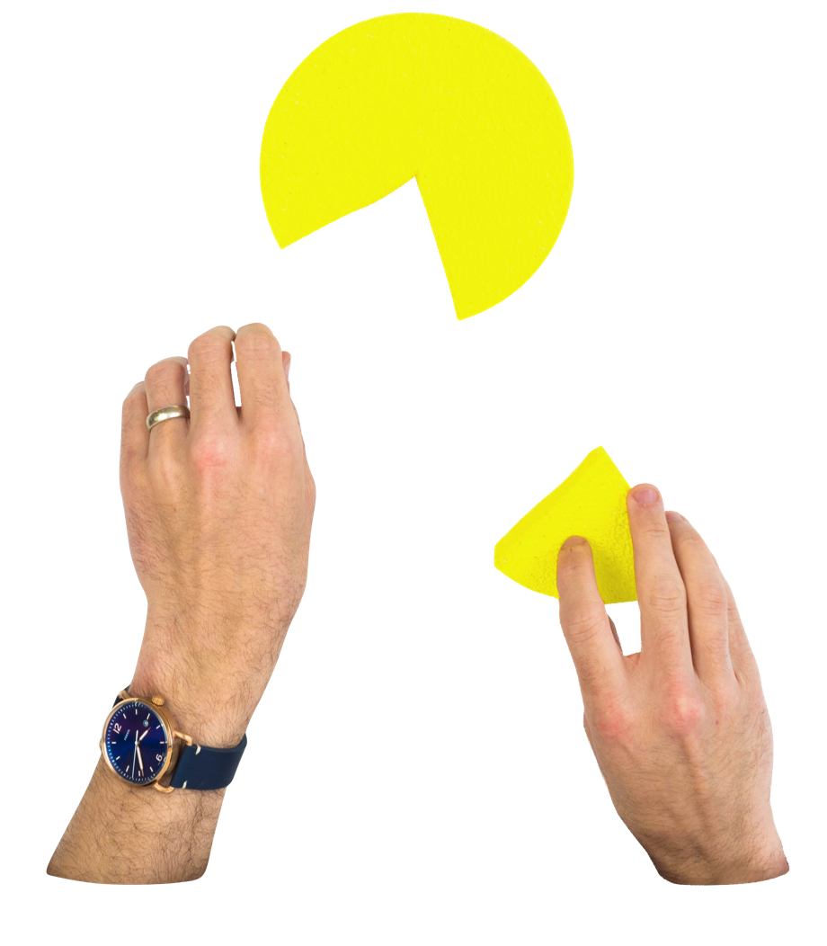 Hands putting together a pie chart with a missing piece