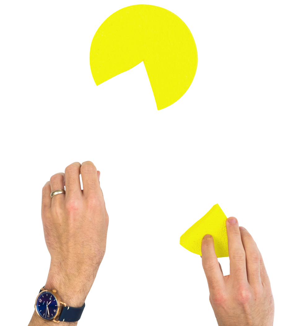 Hands putting together a pie chart with a missing piece