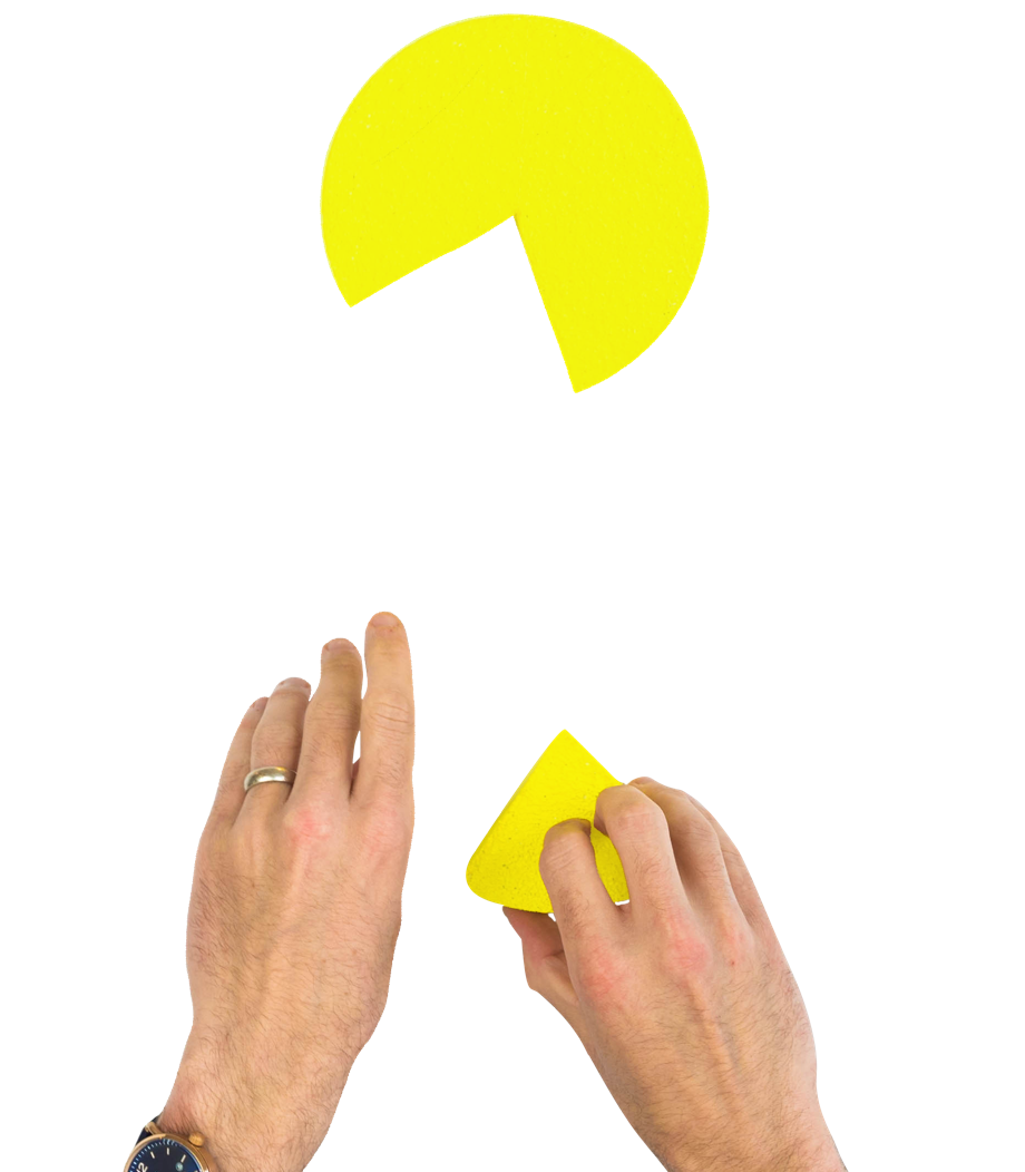 Hands putting together a pie chart with a missing piece