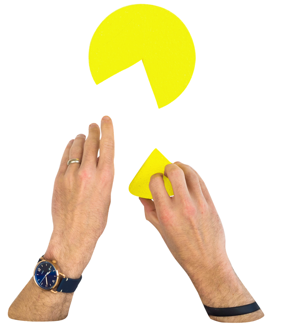 Hands putting together a pie chart with a missing piece