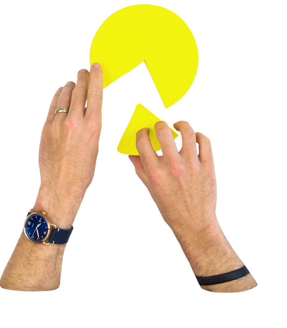 Hands putting together a pie chart with a missing piece