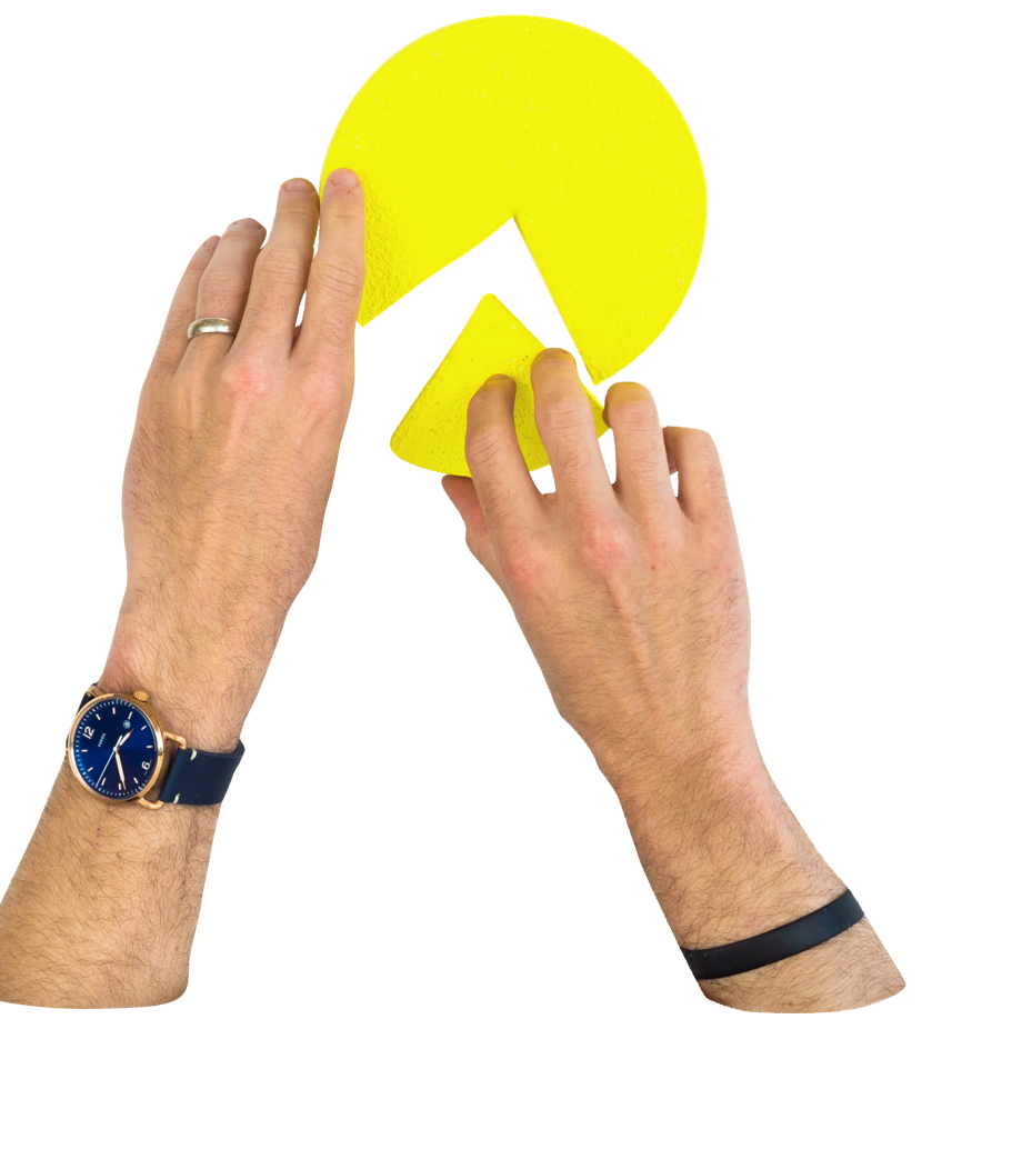 Hands putting together a pie chart with a missing piece